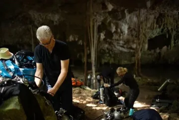 Patrick W. Martin preparing dive equipment in a Yucat&aacute;n cenote